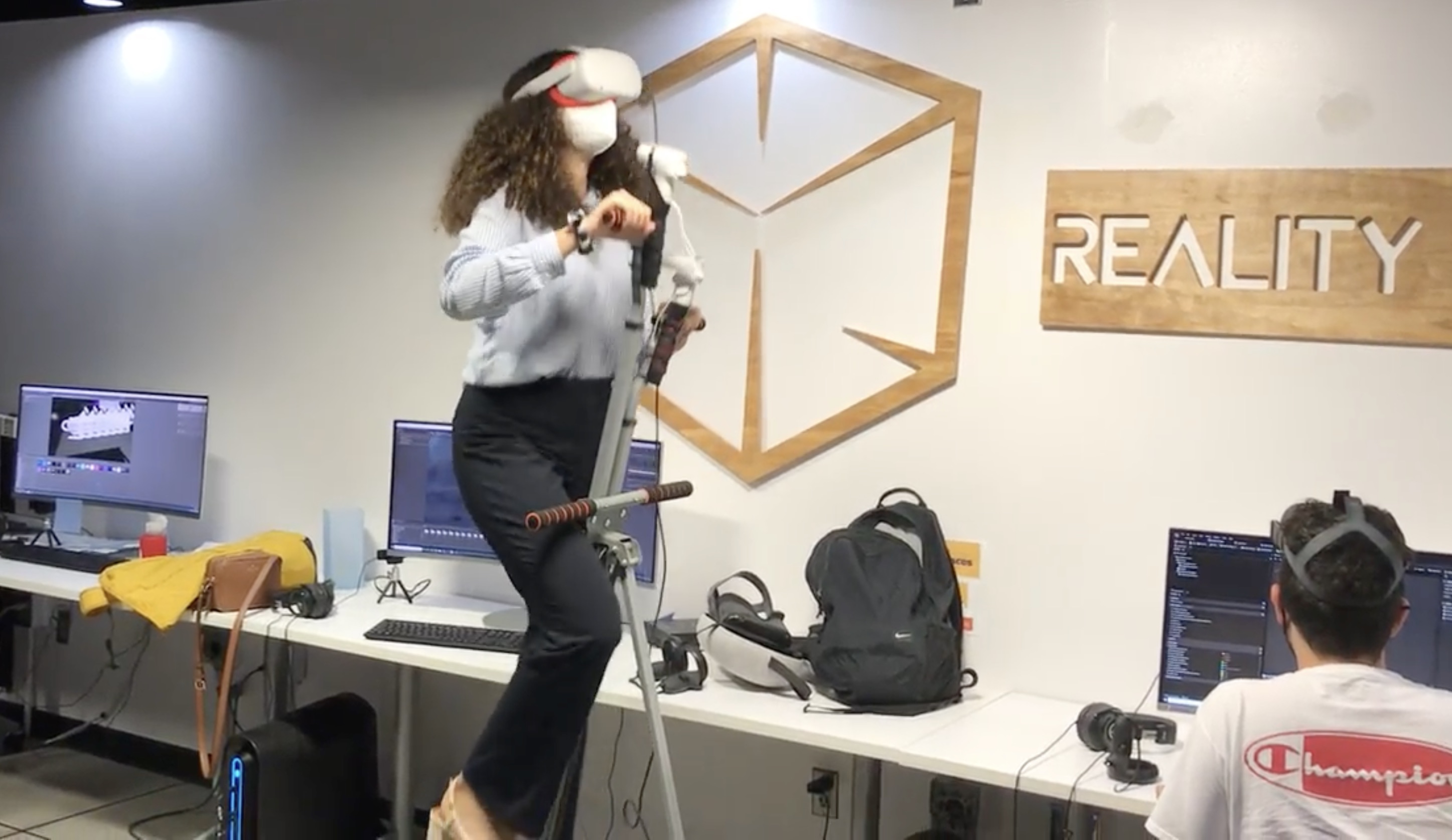 Integrating vertical climbing fitness machine with virtual reality.
